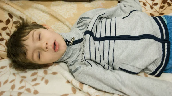 Boy Pretend Asleep — стоковое фото