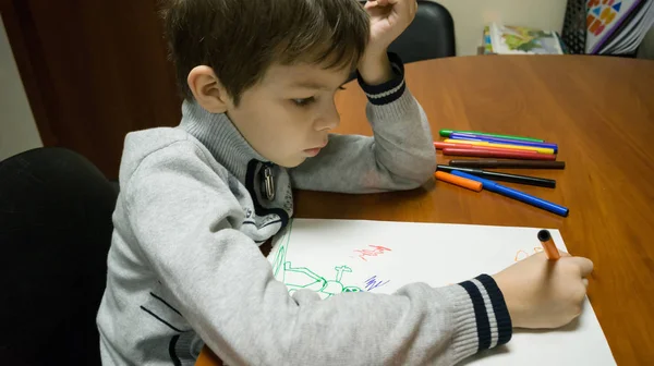 child draws cartoon characters