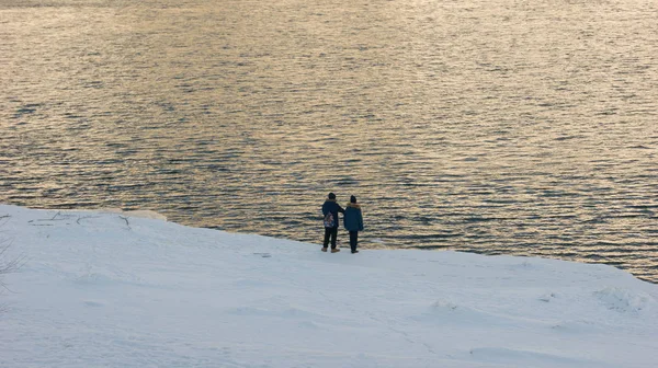 children walk by the river