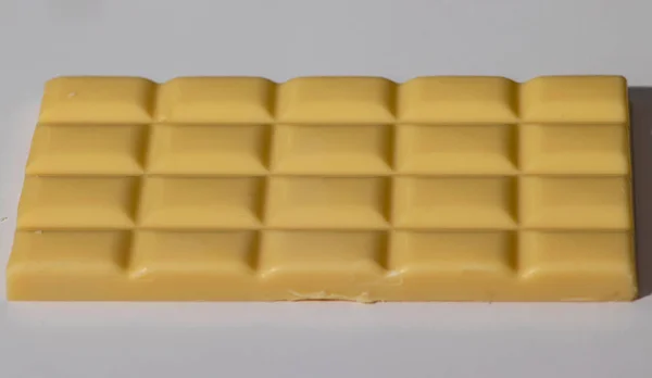 delicious white chocolate tablet with white background