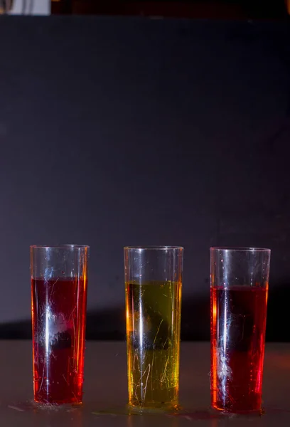 Red and yellow drink glasses with fog — Stock Photo, Image