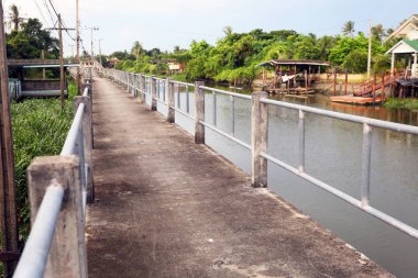 old bridge and river in rural village