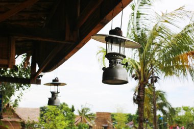 Lighting decorotions hanging on wood ceiling. 