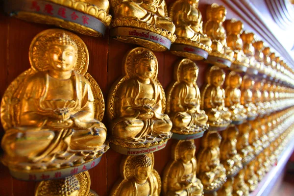 Line of gold buddha culture on the wall