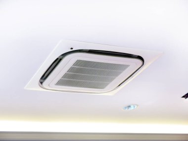 Air conditioner hanging on ceiling in home.