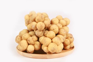 close-up view of Lansium parasiticum or langsat fruits isolated on white background