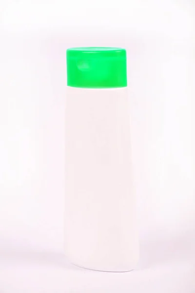 close-up view of cosmetics container on white background