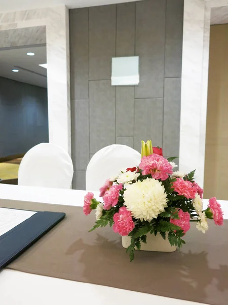 modern restaurant interior with flowers on table