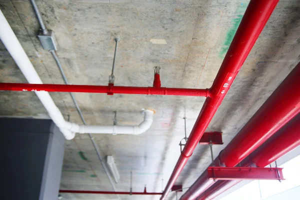 red pipes inside industrial building