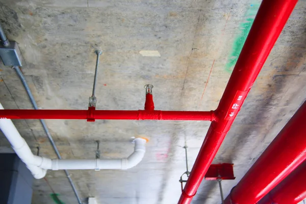 red pipes inside industrial building