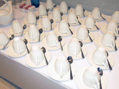 cutlery and dishware on buffet table 