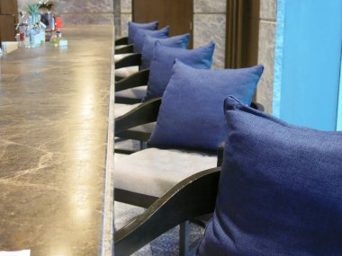 Restaurant table decorations, cushions on chairs