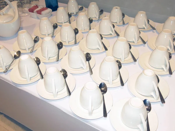 cutlery and dishware on buffet table 