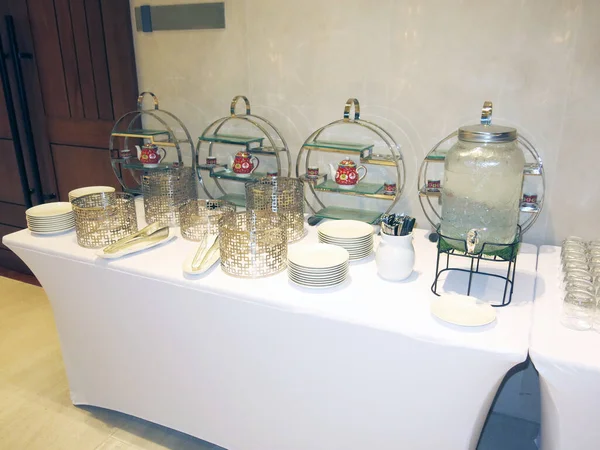 cutlery and dishware on buffet table 