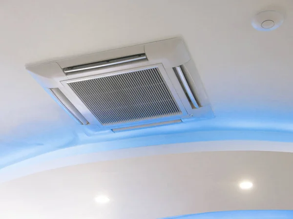 Air conditioner hanging on ceiling in home.