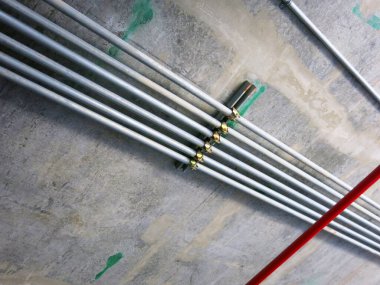 construction site with pipes inside industrial building 