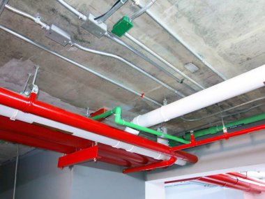 construction site with pipes inside industrial building