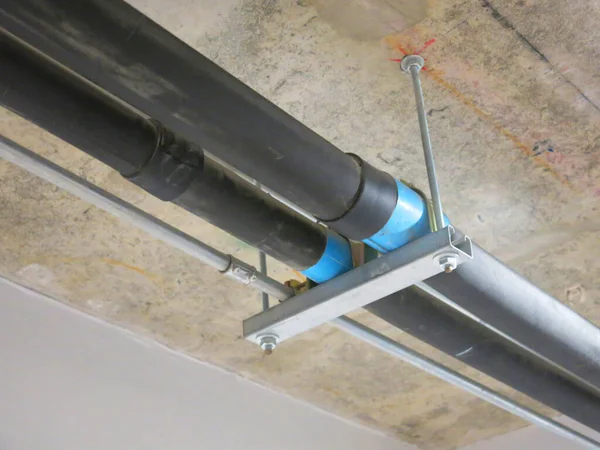 construction site with pipes inside industrial building 