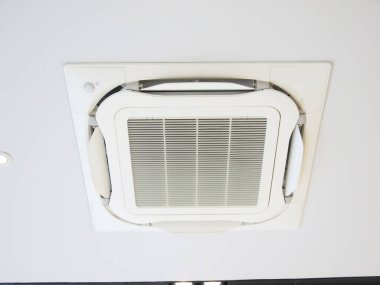 Air conditioner hanging on ceiling in home.