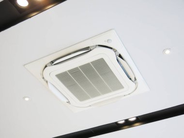 Air conditioner hanging on ceiling in home.