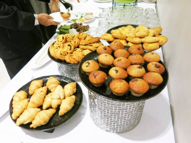 cropped shot of people and delicious sweets desserts on plates