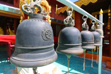 Metal bells hanging in the temple.