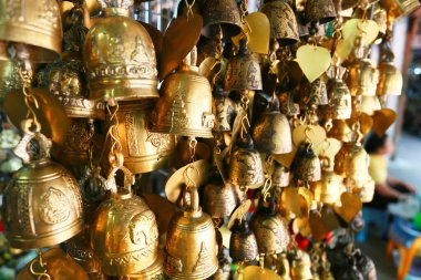 Thai culture souvenirs hanging in shop market.