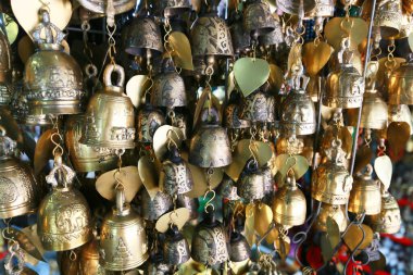 Thai culture souvenirs hanging in shop market.