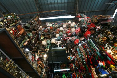 Thai culture souvenirs hanging in shop market.