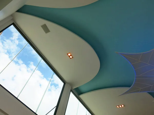 Modern ceiling with lighting design in home.