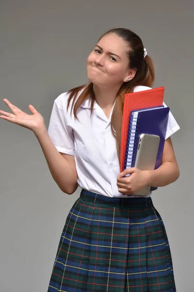 Indecisive Girl Student Wearing Uniform With Books