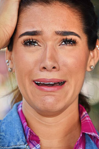 Tearful Adult Female Wearing Pink Shirt