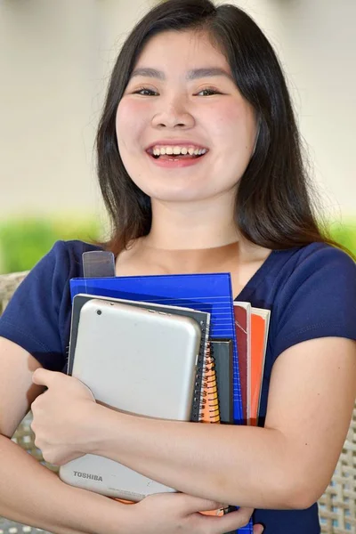 Chinese Girl Student Laughing With Books