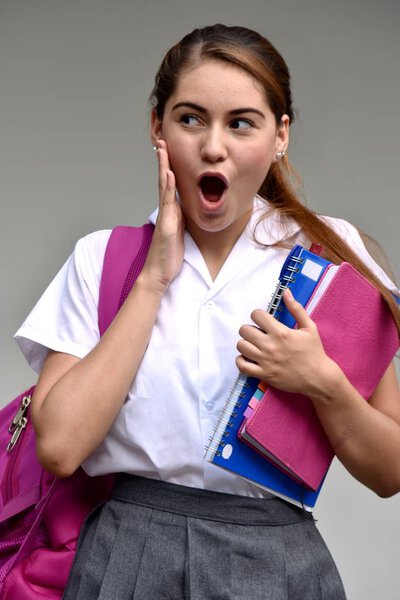Surprised Catholic Colombian Female Student With Books