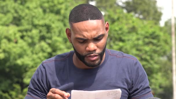 Unhappy Serious Black Man Reading Document — Stock Video