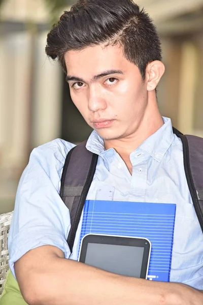 Serious Youthful Student With Notebooks