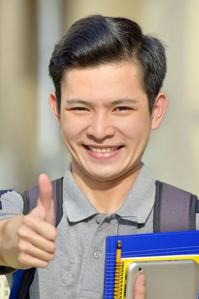 Mannelijke Student Met Duimen Omhoog Met Boeken — Stockfoto