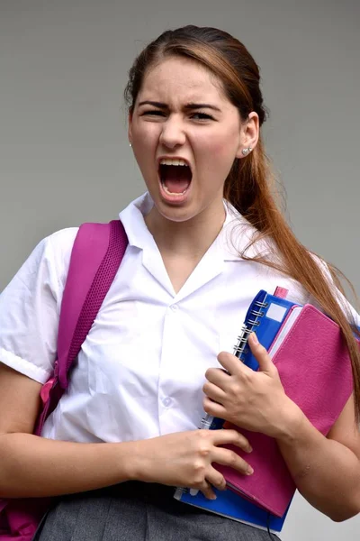 Ansiosa Studentessa Che Indossa Uniforme Con Libri — Foto Stock