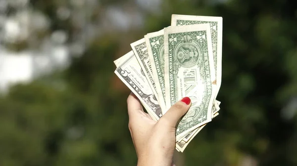 Female Hand Holding Cash Dollars — Stock Photo, Image
