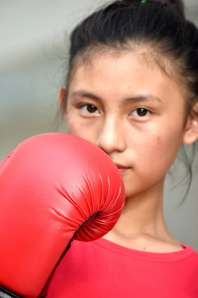 Unemotional Female Boxer Wearing Boxing Gloves