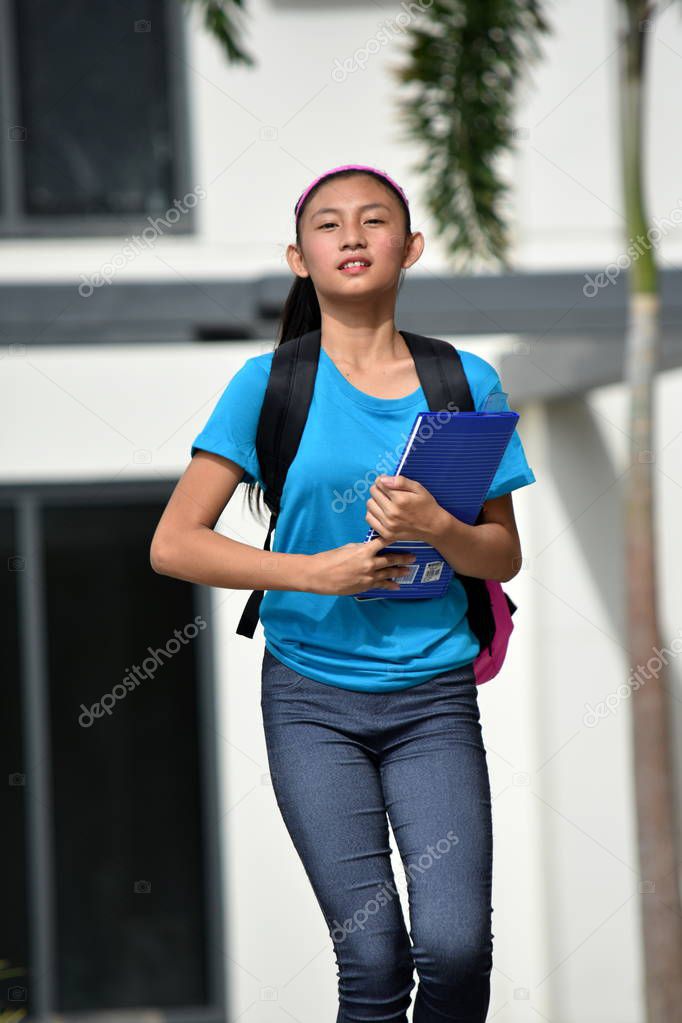 Serious Female Student Walking