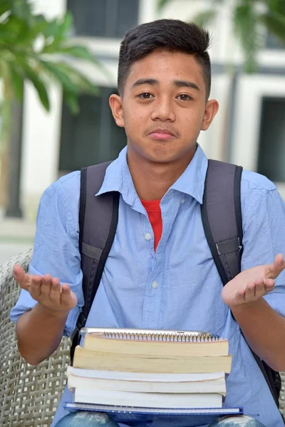 Undecided Male Student With Notebooks