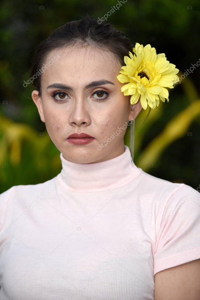 Unemotional Filipina Adult Female With Flowers