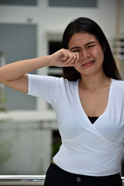 A Crying Filipina Person