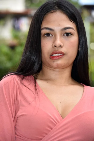 An Asian Female Smirking