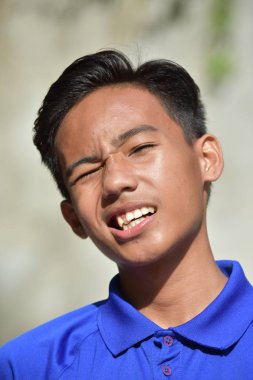 A Diverse Boy Winking