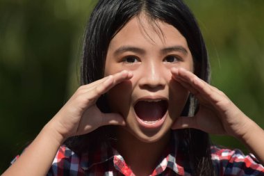 Youthful Filipina Adolescent Yelling clipart