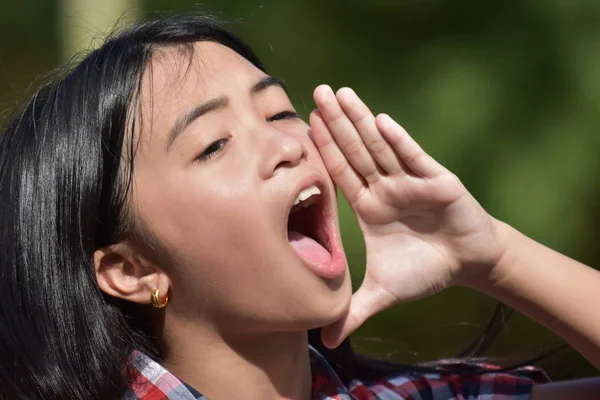 An Asian Youth Shouting