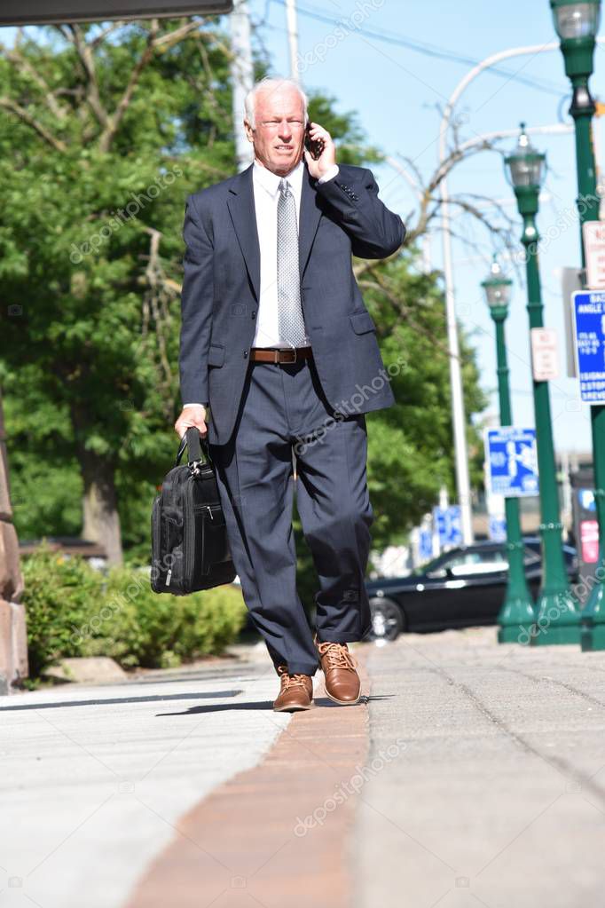 Unemotional Adult Senior Person Wearing Suit And Tie Walking