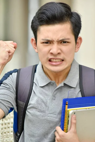 Angry College mångsidig person med böcker — Stockfoto